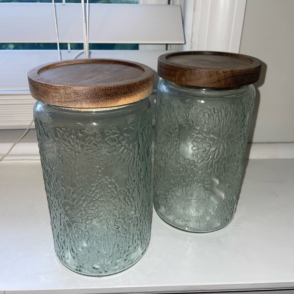 Set of Two Embossed Glass Jars with Wooden Lids